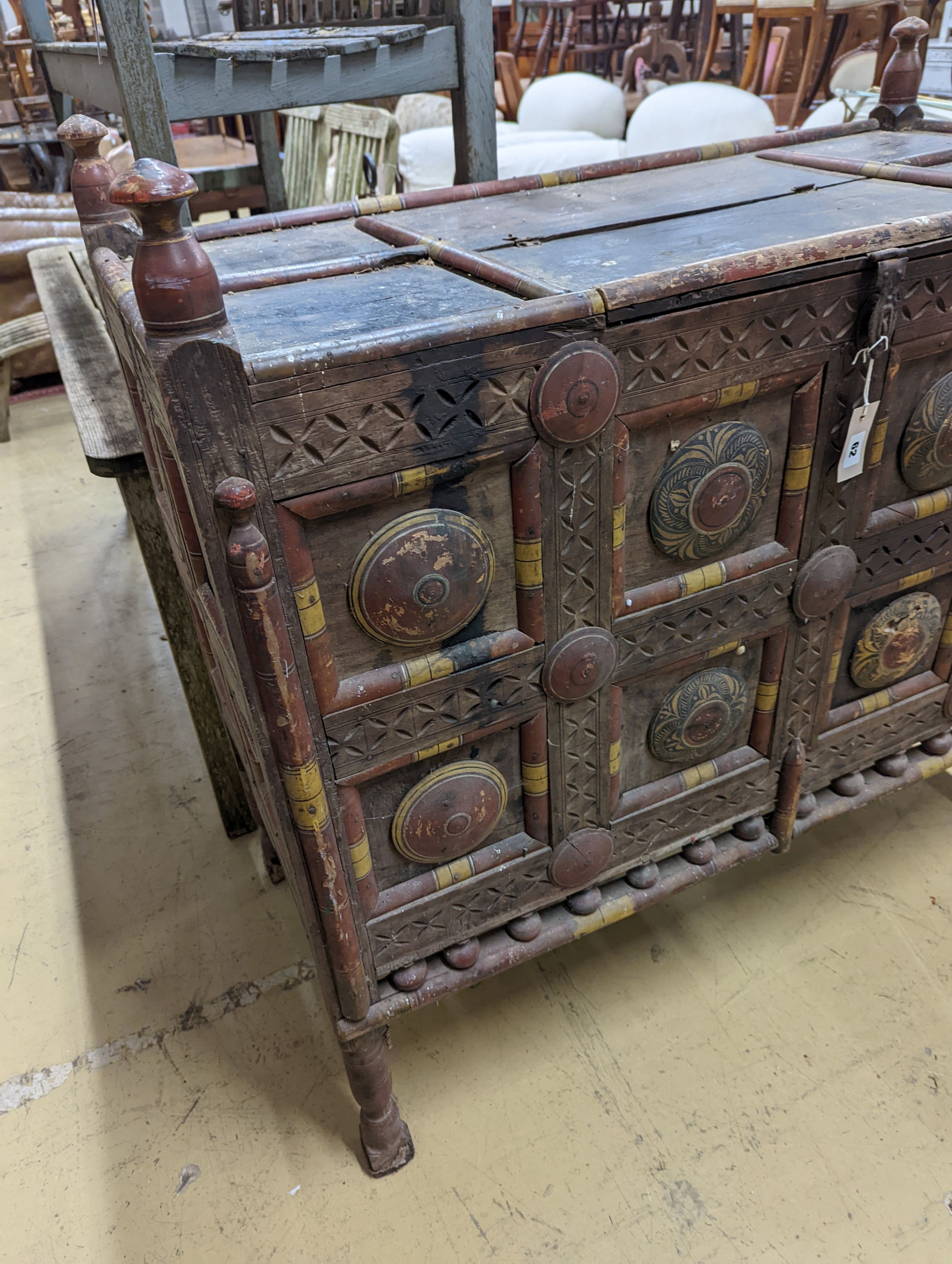 An Indian painted panelled dowry chest. W-117cm, D-56cm, H-113cm.